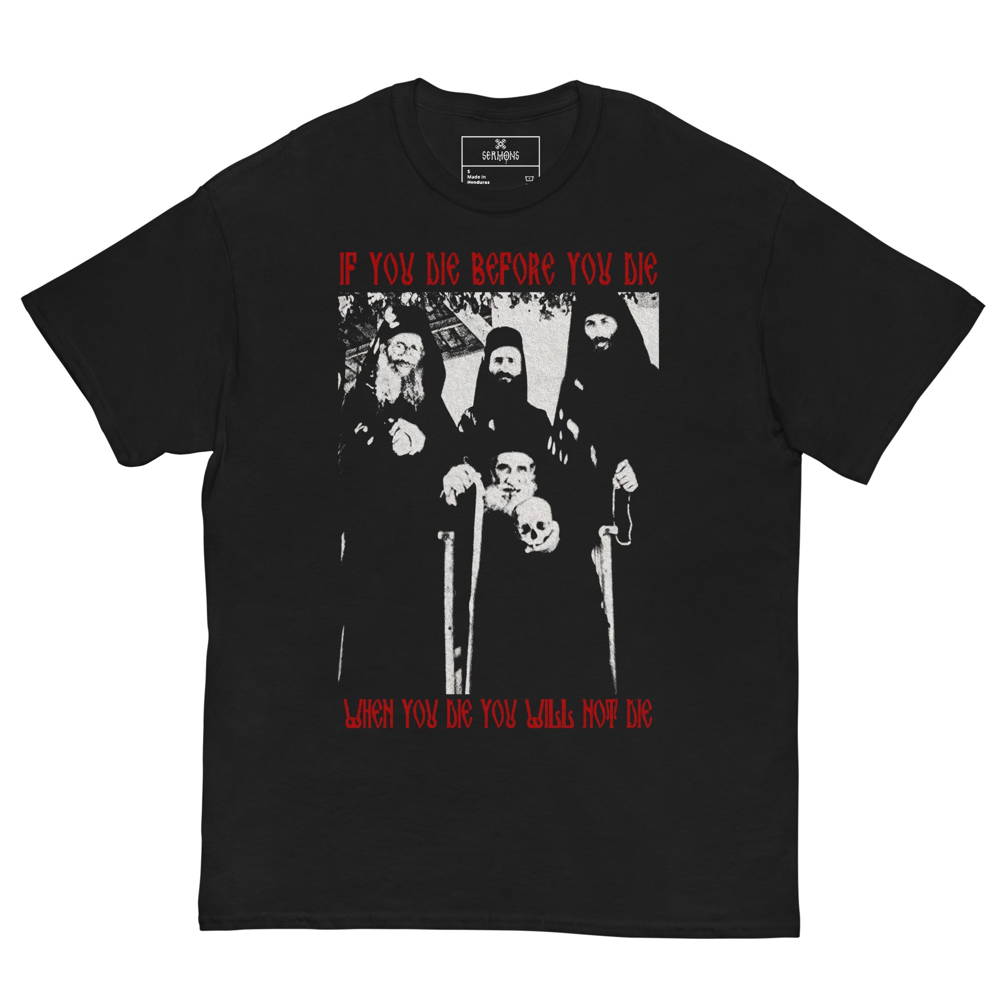 The front view of the Die before you die T-Shirt.  The design captures Elder Arsenios the Cave-Dweller holding the skull of Elder Joseph the Hesychast, on the day of the uncovering of his holy relics.